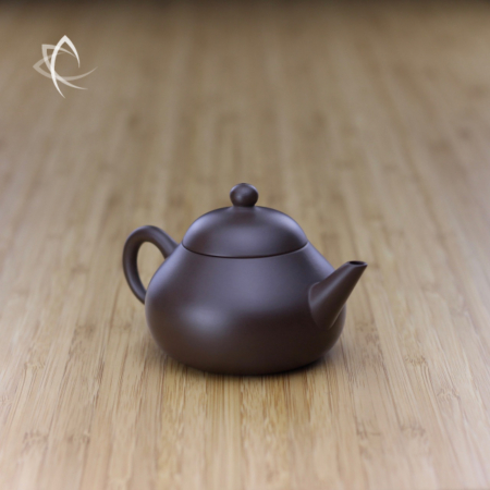 Small Stubby Pear Shaped Purple Clay Teapot Angled View