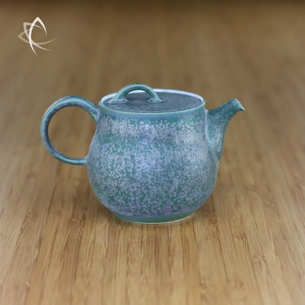 https://www.taiwanteacrafts.com/wp-content/uploads/2023/11/Moss-Mist-Flat-Lid-Pear-Shaped-Short-Spout-Teapot-Featured-View.webp